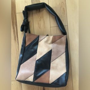 New soft vinyl shoulder bag. it’s never been used